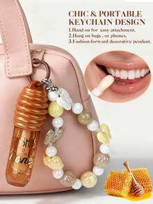 USHAS Honey Nourishing Moisturizing Lip Oil, Creative Pendant Design For Hanging On Bags Or Phones, Deep Moisturization And Hydration, Non-Sticky Formula, Day And Night Nourishing Care, Fashionable Makeup Accessory For Holidays, Creates Plump, Dewy Lips