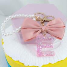 三件套：闪亮粉色洋葱亮片、26个树脂大写英文字母、18K镀金龙虾扣扁环链，搭配时尚粉色布艺蝴蝶结和仿珍珠串珠装饰配件，适用于包包链、手机挂绳、钥匙扣，也可作为礼物送给朋友、母亲、车饰、包包挂饰、背包挂件、带证件夹的挂绳、汽车装饰、圣诞汽车饰品、老师、姐妹等。 - 粉色 - 查看 7