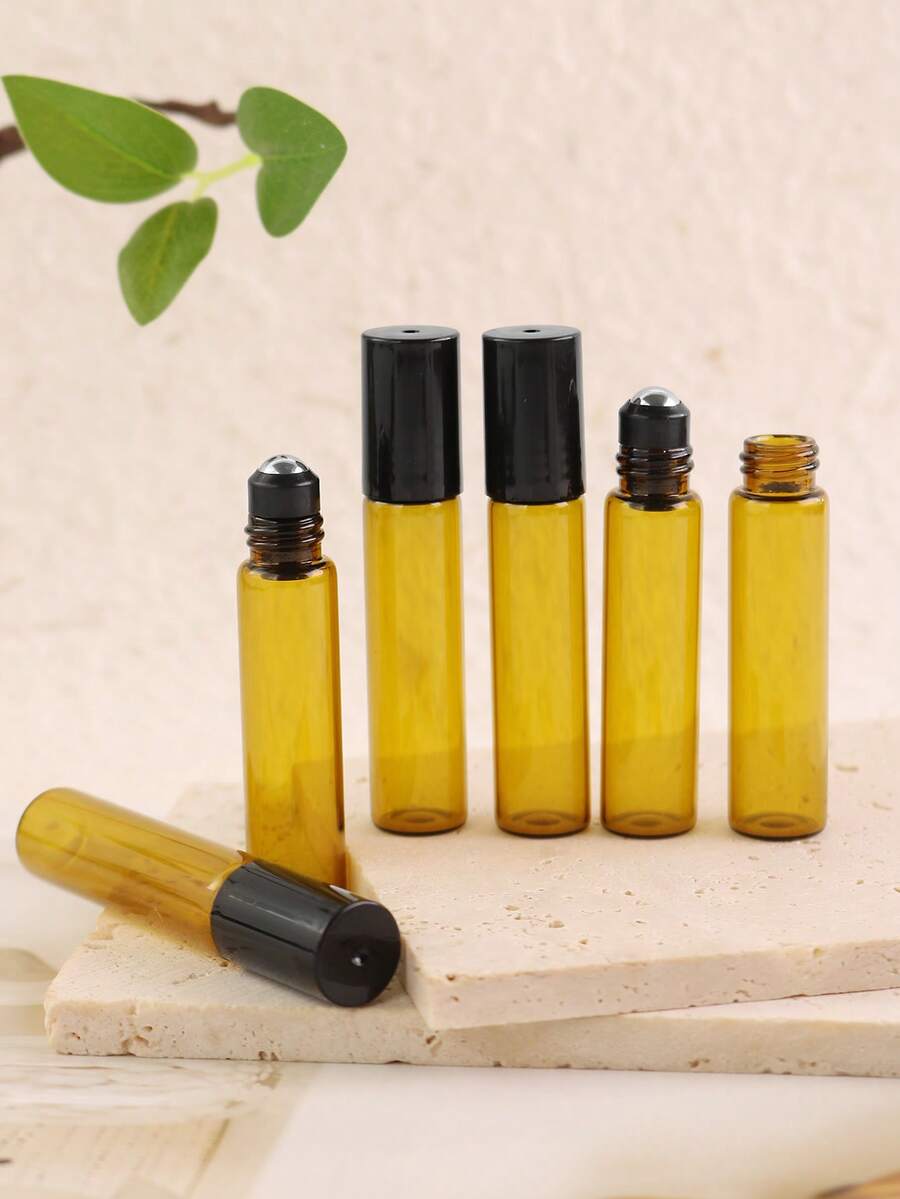 8/50 piezas Botellas de vidrio ámbar con bola de rodillo de 5ml - Diámetro inferior de 14mm con diseño delgado - El color ámbar evita la exposición a la luz para evitar la evaporación y reacción del líquido - Rellenable - Portátil para muestras de tamaño de viaje - Adecuado para perfume, aceites esenciales, aromaterapia, masaje - Excelente regalo para amigos y familiares - Multicolor - Ver 1