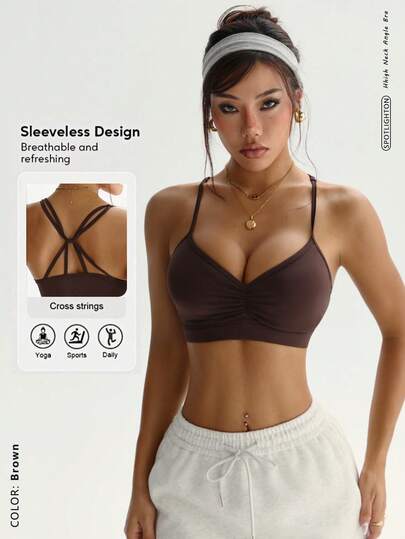 交叉露背吊带背心，丰胸运动文胸，凸显曲线，加厚衬垫和交叉肩带设计，提拉胸部，塑造纤细身形，为健身、瑜伽提供背部支撑。性感交叉露背运动上衣，加厚衬垫女士运动文胸