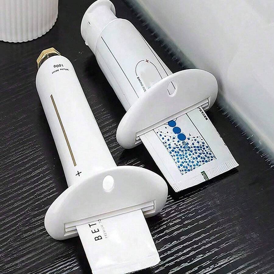 3 个牙膏挤压器(颜色随机),牙膏夹,洗面奶和护手霜分配器,手动样品管挤压器,护手霜挤压器,洗面奶管支架,手动牙膏滚轮。 - 彩色 - 查看 1