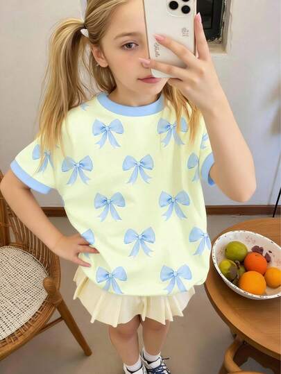 Summer Girls Cute Cream & Fresh Blue Bow Print Loose Casual Round Neck Comfortable Short Sleeve T-Shirt, Suitable For Music Festivals, Campus Casual, Outdoor Picnics, Hiking, Street Style, And Home Wear