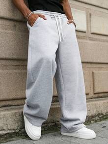 1 szt. Luźne, sportowe spodnie męskie, minimalistyczny, jednolity kolor, szerokie nogawki, ściągacz w pasie, duże kieszenie, odpowiednie do codziennego chodzenia, pracy, podróży itp. "Ze względu na różnice w partiach produkcyjnych mogą występować pewne różnice w kolorach".