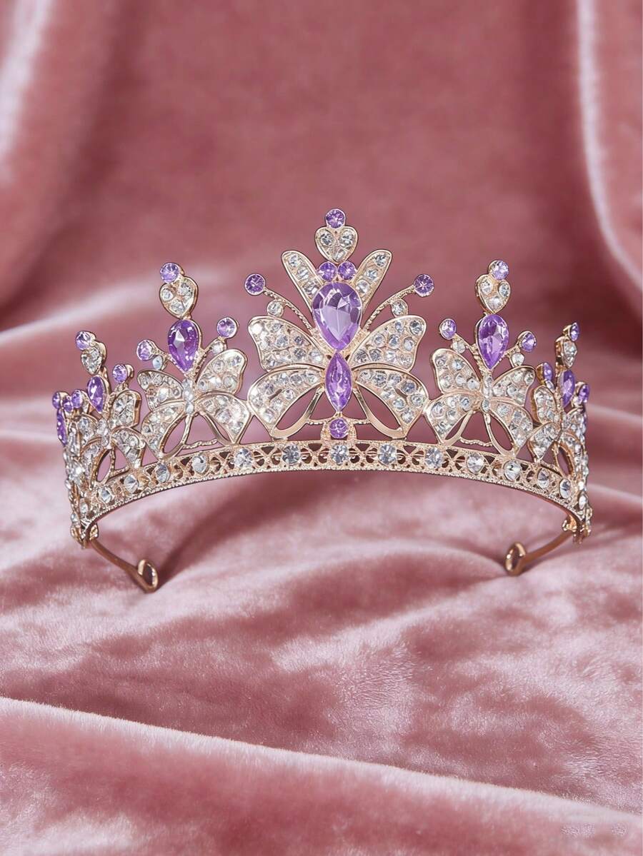 1件镶满水钻的蝴蝶核心元素吊坠，配以水滴形红宝石点缀，采用镂空纹理和小红宝石装饰，融合了甜美与奢华的风格，适合生日派对、拍照、正式礼服，也可作为儿童/青少年的装饰头饰。