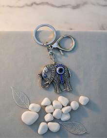 TendenciaLlavero Elefante Ojo Turco Buena Suerte Proteccion PlateadoCalidad premium
