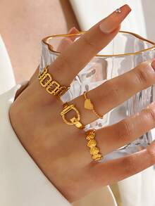 4件套不锈钢简约心形线条设计戒指套装，时尚百搭，适合女性日常佩戴，亦可作为节日礼物。