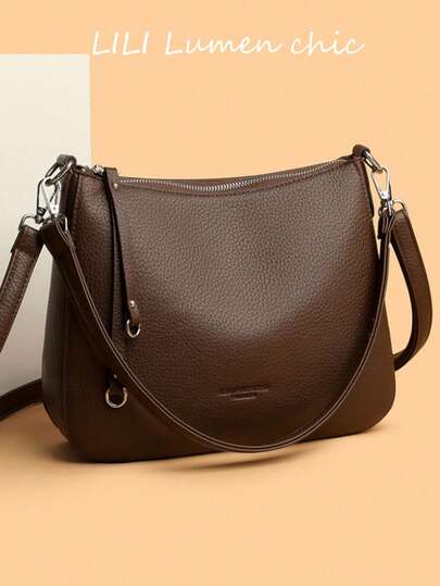 Diese echte Leder Damen Soft Schultertasche ist eine luxuriöse Designer Umhängetasche, eine lässige Schultertasche und eine Pendler Messenger Tasche. Ihr Innenraum kann Lippenstift, Schlüssel, Kosmetik und andere tägliche Essentials aufnehmen, was sie zur idealen Wahl für Damen Arbeit, Einkaufen oder Dates macht.