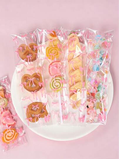 50/100 piezas Bolsas de plástico transparente con patrón de lazo rosa para empacar regalos, dulces, galletas, bocadillos y decoraciones para baby shower, fiesta de cumpleaños, revelación de género, boda y talla grande