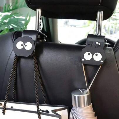 2 piezas Ganchos de asiento de carro de bola de carbón negro lindos y de dibujos animados - Universales, resistentes, se pueden usar para colgar bolsos, carteras, abrigos | Accesorios para el interior del automóvil