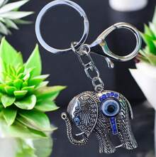 TendenciaLlavero Elefante Ojo Turco Buena Suerte Proteccion PlateadoCalidad premium