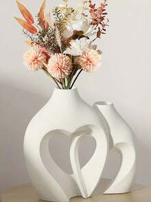 两件套简约现代花瓶，散发着浓郁的斯堪的纳维亚风格。这些花瓶可用于书架装饰，其精致的设计和独特的波西米亚魅力使其成为客厅、玄关或咖啡桌上的绝佳家居装饰品。