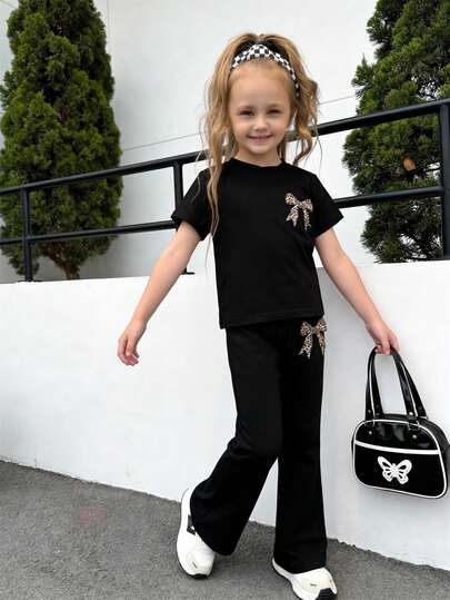 两件套少女夏季时尚套装，黑色短袖T恤+喇叭裤，豹纹蝴蝶结装饰，百搭休闲运动风