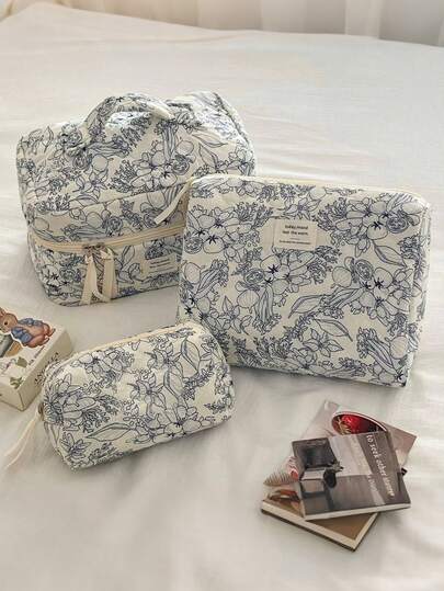 Trousse de toilette blanche matelassée à fermeture éclair, motif orchidée blanche, grande capacité, élégante et décontractée. Idéale pour les voyages et les loisirs créatifs.