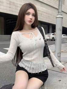 韩版时尚大圆领修身破洞针织衫设计感露肩系带蝴蝶结长袖毛衣女士外出休闲可爱