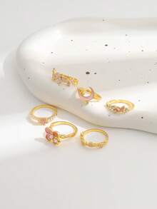 Set de 6 anillos de esmalte con diseños de flor, estrella y luna, anillos apilables con flores rosas y perlas falsas para mujeres - Dorado - Ver 4