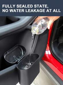 Kosz na śmieci do samochodu z pokrywą, szczelna konstrukcja, możliwość przechowywania chusteczek, obierków i innych śmieci, wielofunkcyjny kosz na śmieci do samochodu, łatwy do czyszczenia i demontażu, odpowiedni na przednie i tylne siedzenia, do biura i domu, odpowiedni zarówno dla mężczyzn, jak i kobiet, idealny wybór do organizacji samochodu i doskonały dodatek do wnętrza. - Czarne - Zobacz 6