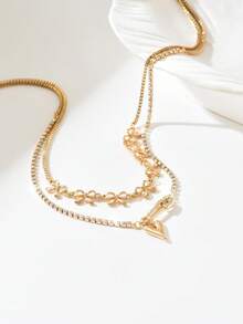 这款欧式中东时尚蝴蝶结、心形胸针、玻璃水钻吊坠项链，双层设计，尽显女性独特风格与魅力，尤其适合派对、婚礼、节日等特殊场合，也是一份精美的礼物。