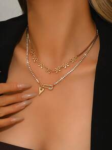 这款欧式中东时尚蝴蝶结、心形胸针、玻璃水钻吊坠项链，双层设计，尽显女性独特风格与魅力，尤其适合派对、婚礼、节日等特殊场合，也是一份精美的礼物。