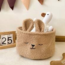 咖啡棕色布艺兔子收纳篮 | 咖啡棕色布艺卡通毛绒兔子收纳篮，刺绣设计，非常适合收纳零食、玩具和化妆品，是卧室、书桌和汽车内饰收纳的理想之选。 - 彩色 - 查看 9