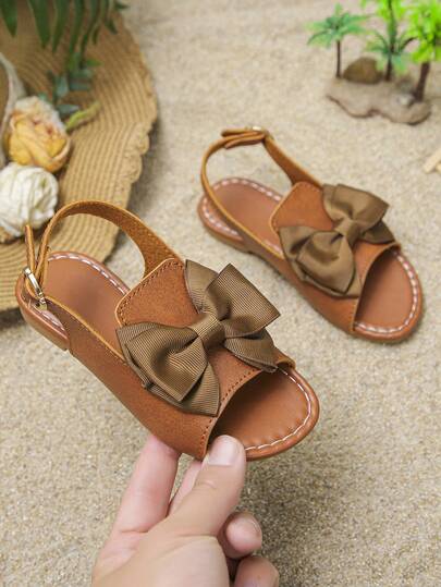 1 đôi sandal công chúa đế mềm hở mũi, đính nơ và đá lấp lánh, kiểu dáng mới cho bé gái mùa xuân và hè, giày La Mã chống trượt đa năng phù hợp cho du lịch, kỳ nghỉ và đi học.