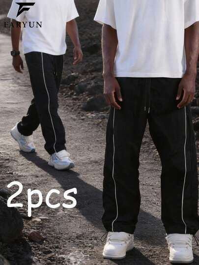 功能性户外徒步裤，侧边撞色条纹设计，宽松版型，裤脚抽绳可调节松紧，适合户外活动