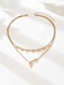 这款欧式中东时尚蝴蝶结、心形胸针、玻璃水钻吊坠项链，双层设计，尽显女性独特风格与魅力，尤其适合派对、婚礼、节日等特殊场合，也是一份精美的礼物。