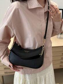 1个纯色PU皮革时尚腋下包。这是一款简约时尚的大容量单肩包、商务通勤斜挎包和日常办公小手提包。适合女生、女大学生、职场新人以及白领人士。非常适合办公室、大学、工作、商务、通勤、户外活动、旅行和外出等场合。 - 黑色 - 查看 3