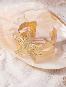 1 chiếc vòng tay dạng hở kết hợp hình dây thừng và sao biển được làm thủ công rỗng ruột, phù hợp với phong cách nghỉ dưỡng tối giản ven biển. - Vàng - Xem 2