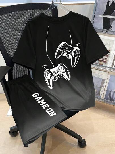 Conjunto de camiseta de manga corta con cuello redondo y estampado gráfico de dibujos animados, y pantalones cortos para niño joven