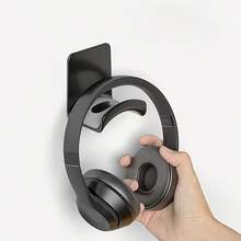 1个壁挂式耳机支架 - 无需钻孔，多功能塑料耳机支架带挂钩，适用于电脑游戏耳机，节省空间设计，是家庭、办公室和游戏环境的理想之选，可用于耳机收纳，外观时尚现代。