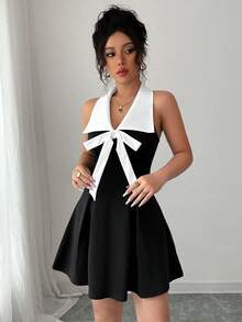 黑白撞色性感翻领V领无袖A字连衣裙，领口饰有蝴蝶结，优雅通勤休闲时尚，适合生日派对、毕业派对、下午茶聚会和旅行等场合，辣妹风春夏新款女装 - 黑與白 - 查看 5