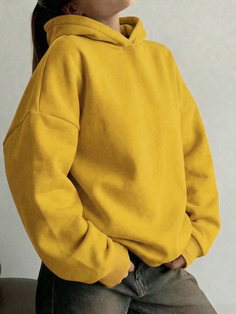 Thiết kế tối giản, áo hoodie dài tay rộng rãi, màu trơn thoải mái dành cho nữ, phù hợp cho mùa thu/đông, là món đồ không thể thiếu trong tủ quần áo, trang phục thường ngày, công sở và giải trí, áo kiểu casual giúp thon gọn vóc dáng, áo sweatshirt mềm mại và thoải mái, đồ cần thiết cho kỳ nghỉ, trang phục mùa xuân/đông dành cho nữ, áo khoác ngoài dành cho nữ, áo hoodie thời trang dành cho nữ. - Màu vàng - Xem 1