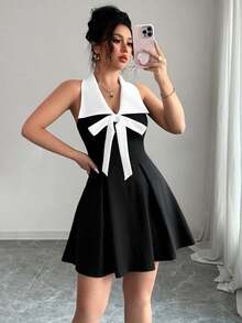 黑白撞色性感翻领V领无袖A字连衣裙，领口饰有蝴蝶结，优雅通勤休闲时尚，适合生日派对、毕业派对、下午茶聚会和旅行等场合，辣妹风春夏新款女装 - 黑與白 - 查看 3