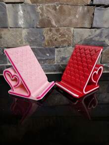 1个浪漫心形手机支架，完美的情人节礼物。时尚的桌面装饰，便携防滑，采用耐用塑料制成，适合家庭或办公室使用。既是手机配件又是支架，是情人节、开学季和生日的理想礼物。 - 彩色 - 查看 6