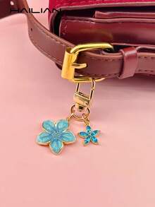 HAILIAN This Lightweight And Elegant Sakura-Shaped Keychain Is Made Of Alloy Material, Designed Specifically For Women, And Features A 5-Petal Sakura Hanging Decoration. It Is A Perfect Travel Accessory That Can Be Used As A Bag Charm Or Car Key Chain, And Also Makes An Ideal Gift For Couples On Birthdays And Holidays. - Aqua Blue - View 5