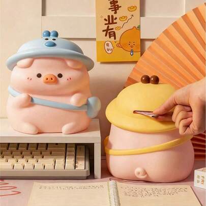 1个大号可爱小猪存钱罐，黄色或蓝色可选，ABS树脂材质，是开学季、节日、家居装饰、存钱、情侣装饰的理想礼物。