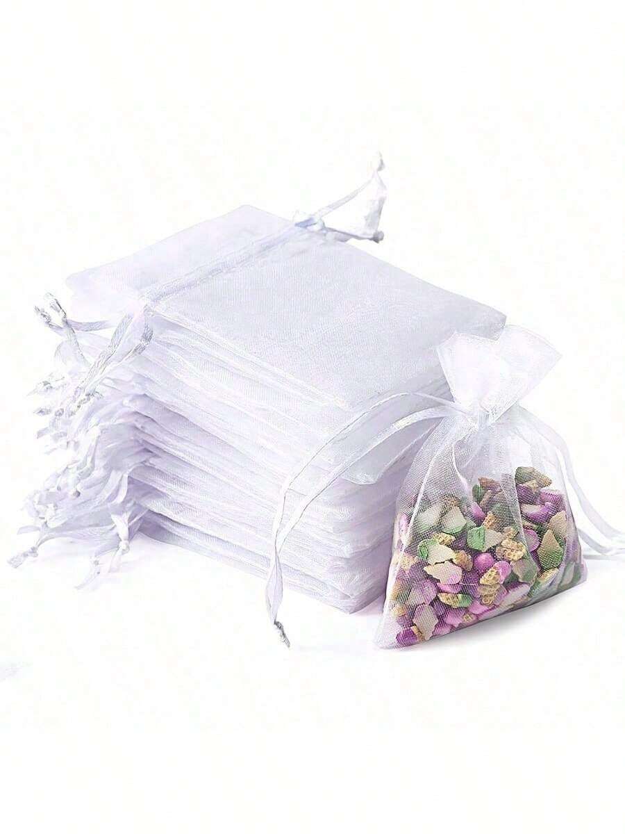 10个优雅白色欧根纱束口袋——非常适合用作即将到来的情人节派对回礼袋、小型礼品包装袋、婴儿派对糖果袋、婚礼回礼袋或日常小物收纳袋。它完美融合了优雅的半透明美感和实用功能,为您的节日庆典和送礼场合增添一抹精致优雅的气息。 - 彩色 - 查看 1