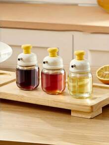 这款玻璃油瓶采用压力控制精准出油和调油功能，设计现代，适用于盛装酱油、醋和调味品。可重复使用的厨房油瓶，采用精准的压力控制出油技术，有绿色和白色两种颜色可选。厨房玻璃油醋瓶。 - 彩色 - 查看 8