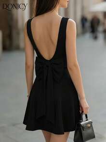 DONICY Women's Black Solid Round Neck Sleeveless Open Back Large Bow Detail Pleated Hem Mini Dress - Stretchy Knit Medium-Thin Slim-Fitting Elegant Sexy Spring Summer Valentine's Day Dating Nightclub Carnival Wear - Black - View 2
