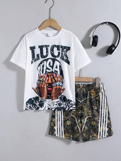 Bộ quần áo thường ngày 2 món cho bé trai: Áo tay ngắn vai rớt in họa tiết ngẫu nhiên và quần short rằn ri cạp chun, thích hợp cho mùa xuân/hè.