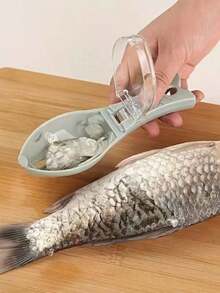 Manual Fish Scaler With Transparent Lid And Integrated Scale Collector Professional Kitchen Tool For Cleaning Fish Without Messing Up The Bar Durable Plastic Scale Remover With Ergonomic Handle And Creative Design For Seafood Preparation In Mexico Ideal For Mojarra Tilapia And Huachinango Modern Kitchen Gadget That Prevents Scales From Flying Everywhere Efficient Cleaner For The Mexican Home Export Quality Durable And Easy To Wash Under The Faucet Essential Accessory For Fresh Fish Lovers Cutting-Edge 2026 Tool For A Clean And Tidy Kitchen Without Scale Splashes On Clothes Or Sink High-Density Food Preparation Tool That Does Not Damage The Fish Skin Essential Seafood Cleaning Kit For The Kitchen Homes That Seek Speed. - 青藍色 - 查看 3