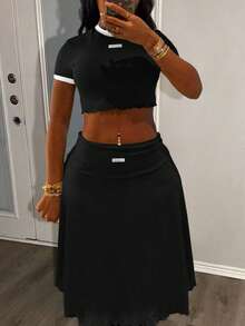 LovelyWholesale Ensemble d'été pour femmes composé d'un Top court à col rond et manches courtes, et d'une jupe mi-longue, pour le printemps et l'été - Noir - Voir 1
