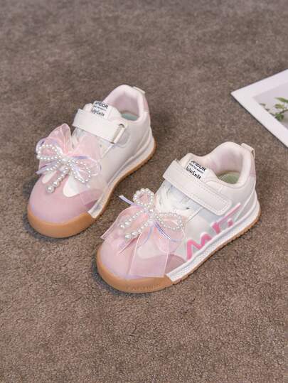 1双新款时尚蝴蝶结装饰女童真皮休闲运动鞋，春秋季款，适合儿童