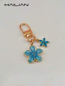 HAILIAN This Lightweight And Elegant Sakura-Shaped Keychain Is Made Of Alloy Material, Designed Specifically For Women, And Features A 5-Petal Sakura Hanging Decoration. It Is A Perfect Travel Accessory That Can Be Used As A Bag Charm Or Car Key Chain, And Also Makes An Ideal Gift For Couples On Birthdays And Holidays. - Aqua Blue - View 4