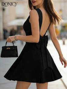 DONICY Women's Black Solid Round Neck Sleeveless Open Back Large Bow Detail Pleated Hem Mini Dress - Stretchy Knit Medium-Thin Slim-Fitting Elegant Sexy Spring Summer Valentine's Day Dating Nightclub Carnival Wear - Black - View 1