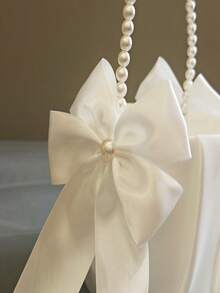 纯色蝴蝶结珍珠手柄花童篮，适合万圣节、圣诞节活动和派对用品，适用场景包括圣诞节、新年、情人节和各种派对活动。 - 彩色 - 查看 3