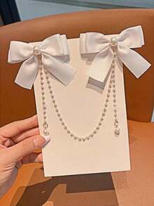 1个青少年时尚甜美珍珠蝴蝶结流苏发夹。由于面料批次不同，可能存在轻微色差，请以包装卡和实物为准。珍珠数量随机。 - 白色 - 查看 3