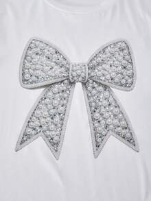 Bộ đồ 2 mảnh dễ thương cho bé gái 8-12 tuổi, áo thun cổ tròn in họa tiết màu trắng và quần ống loe đen kiểu dáng giản dị, trang phục mùa hè thanh lịch và tối giản. - trắng - Xem 10