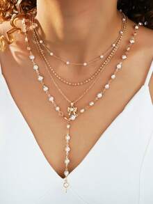 4件套复古朋克波西米亚风人造珍珠蝴蝶结Y型项链套装，优雅设计，适合女性日常、通勤、派对、约会等场合，也是送给女友或母亲的礼物。 - 金黃色 - 查看 4