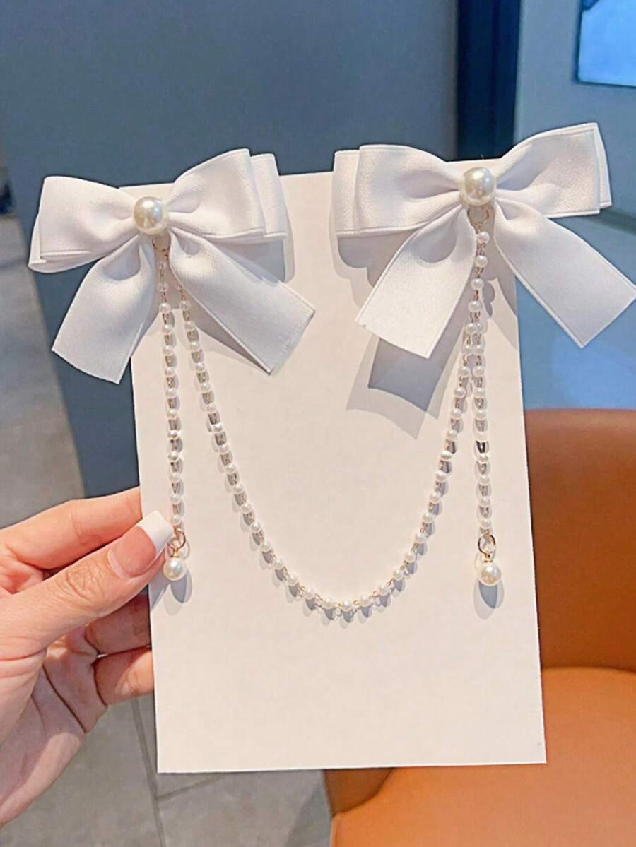 1个青少年时尚甜美珍珠蝴蝶结流苏发夹。由于面料批次不同，可能存在轻微色差，请以包装卡和实物为准。珍珠数量随机。 - 白色 - 查看 1